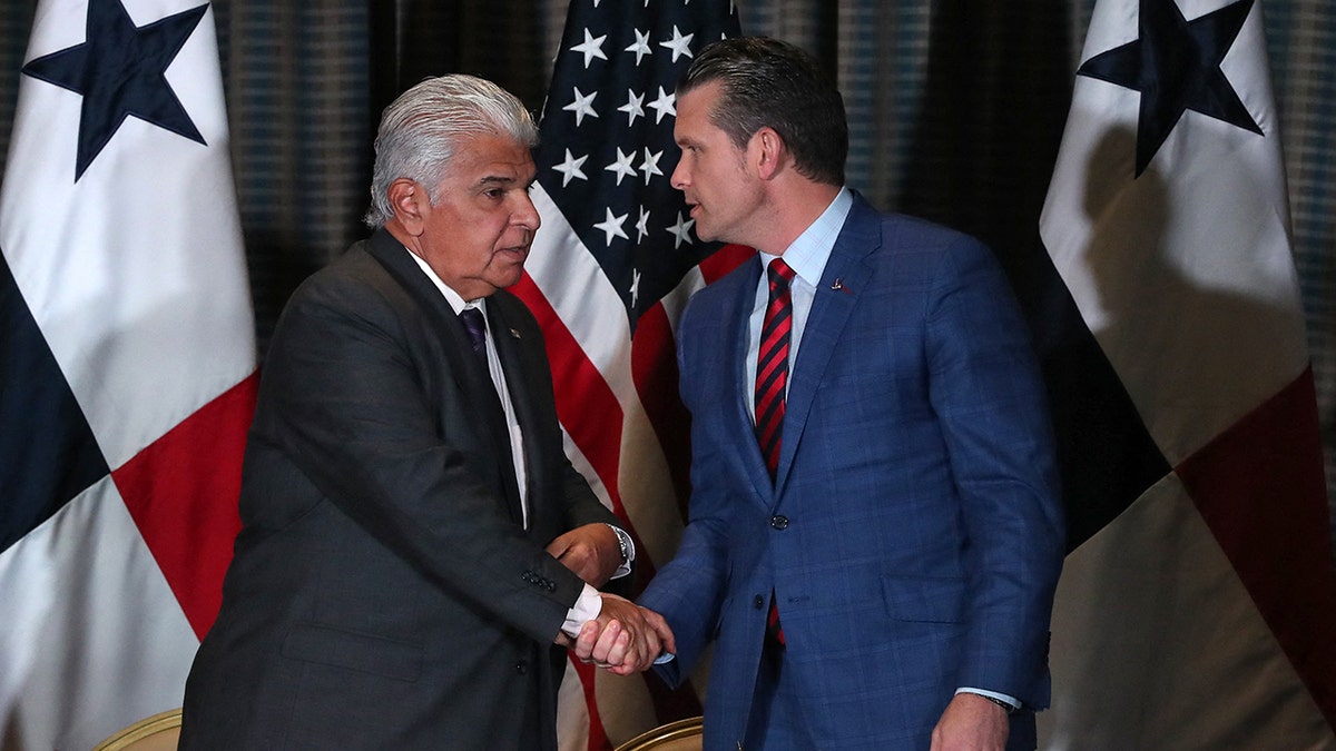 Panama's President Jose Raul Mulino shakes hands with US Secretary of Defense Pete Hegseth