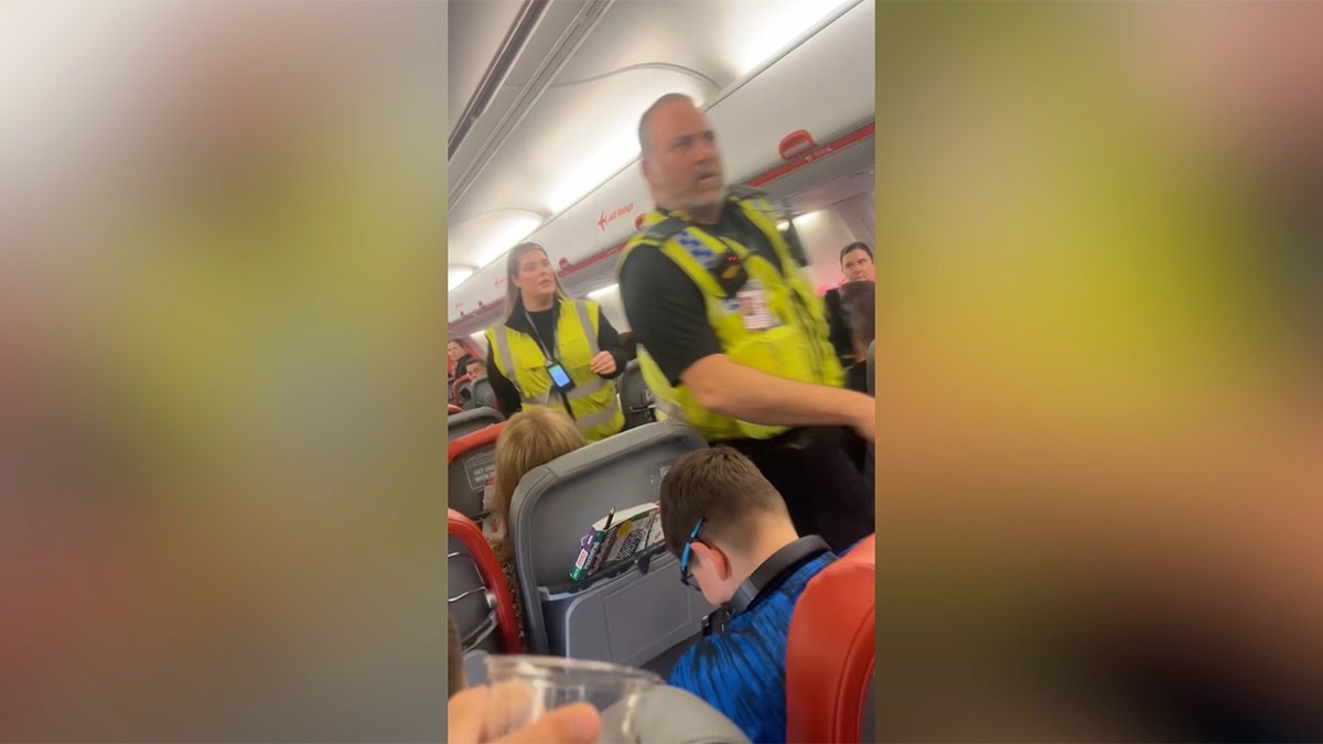 Two men have been banned from flying on a British airline after police removed them from a plane for behaving inappropriately while they were allegedly intoxicated.