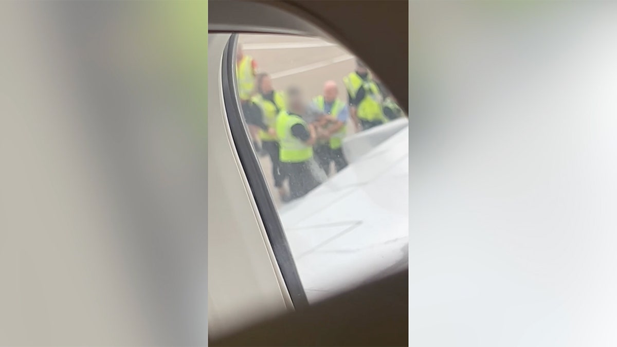 Two men have been banned from flying on a British airline after police removed them from a plane for behaving inappropriately while they were allegedly intoxicated.