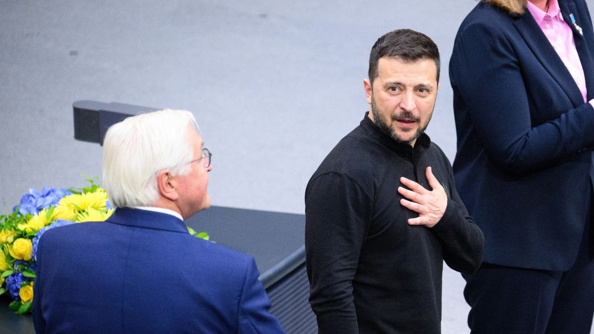 Ukrainian President Volodymyr Zelenskyy puts his hand on his chest