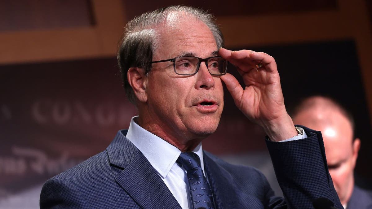 Mike Braun touching his glasses