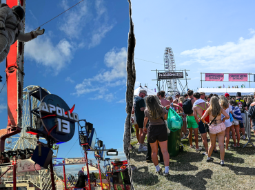 Thrill ride malfunctions at popular music festival, leaving riders stuck upside down