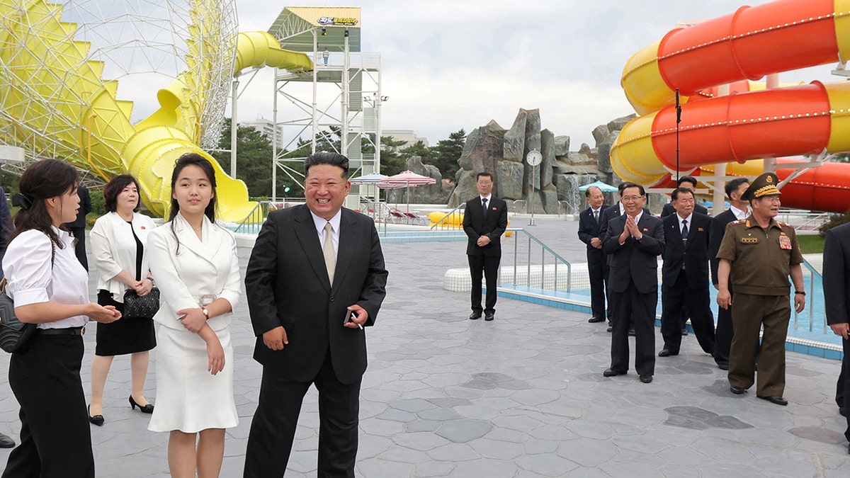 Kim Jong Un seen here with his daughter Kim Ju Ae in June has brought her to China for her first international trip.