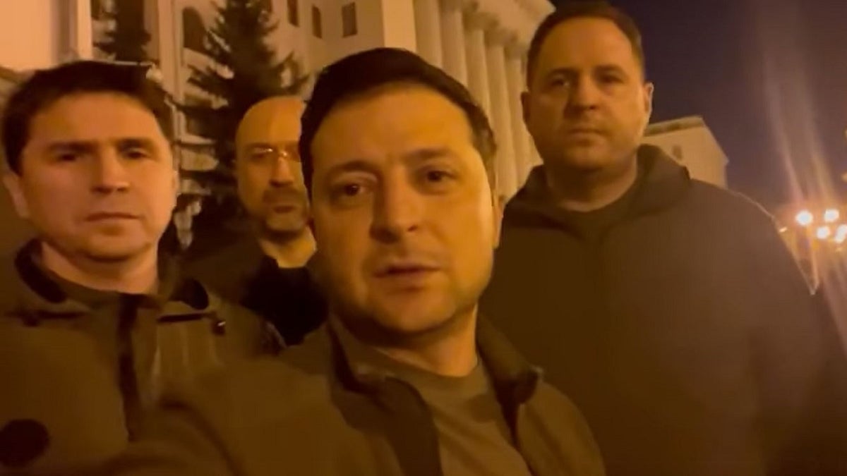 Ukrainian President Volodymyr Zelenskyy posing with other officials.