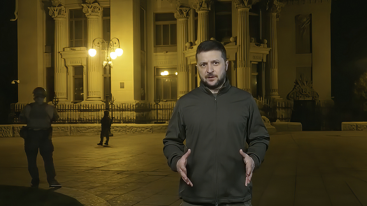 Volodymyr Zelenskyy gesturing with his hands.