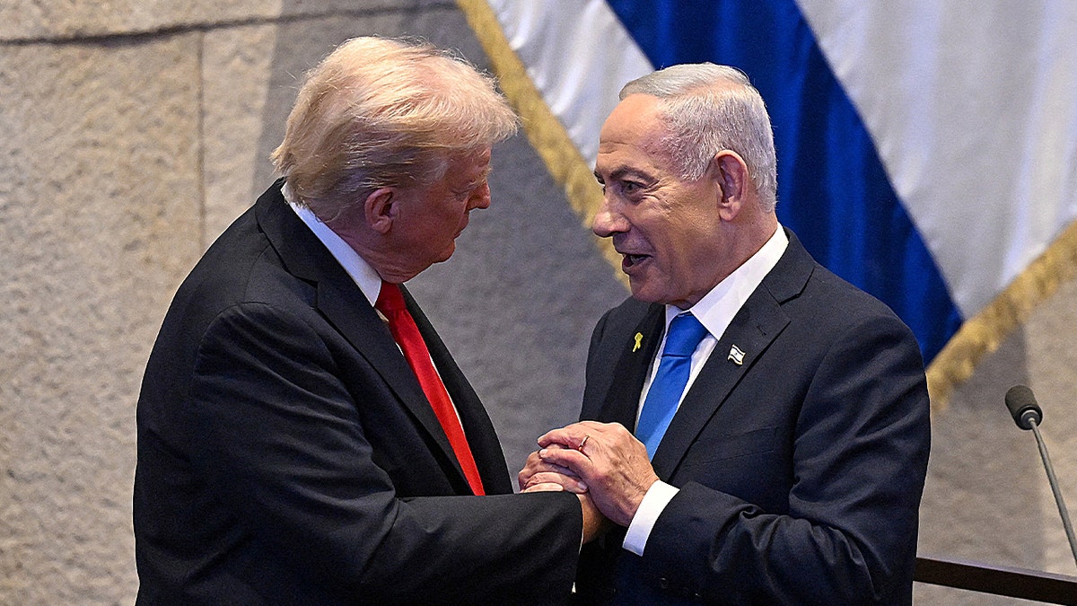 President Donald Trump talks with Israel's Prime Minister Benjamin Netanyahu at the Knesset,