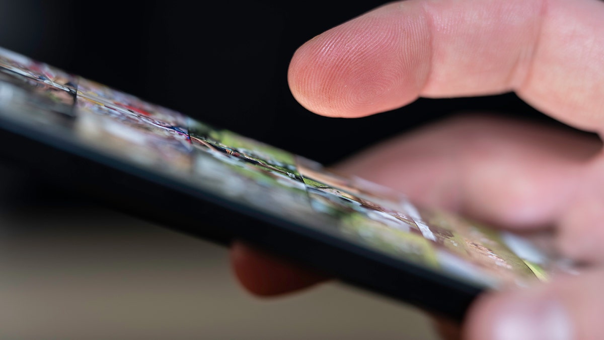 Person using their smartphone.