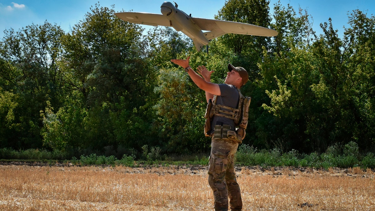 A Ukrainian soldier launches a reconnaissance drone in Zaporizhzhia region, Ukraine.&nbsp;