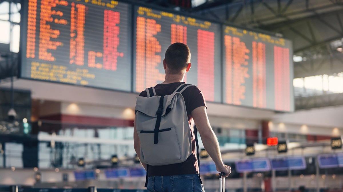 Man standing in an airport.