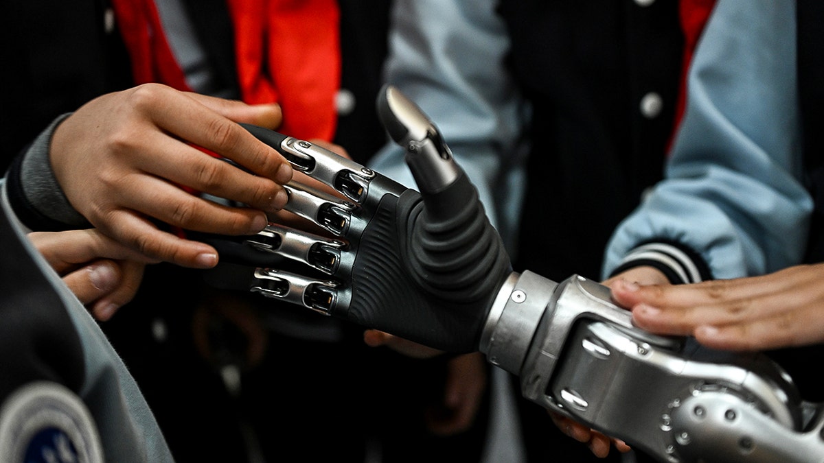 Person testing a robot hand.