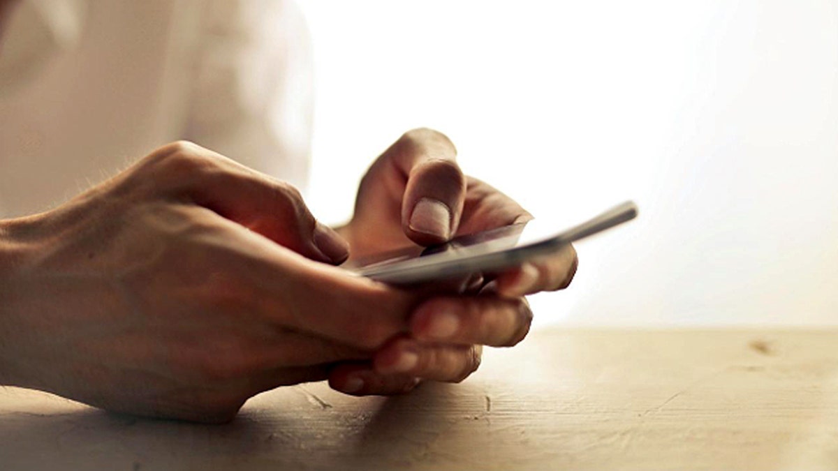 Person holds a phone