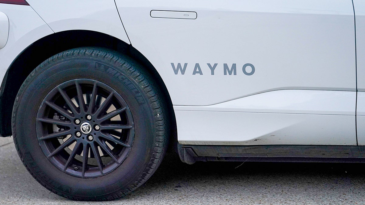 Waymo logo on the vehicle.
