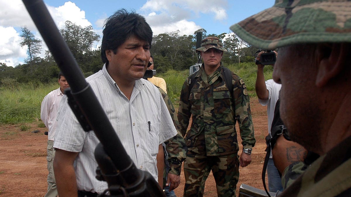 Bolivia's President Evo Morales greeting a member of Bolivia's anti-drugs forces in Santa Cruz province