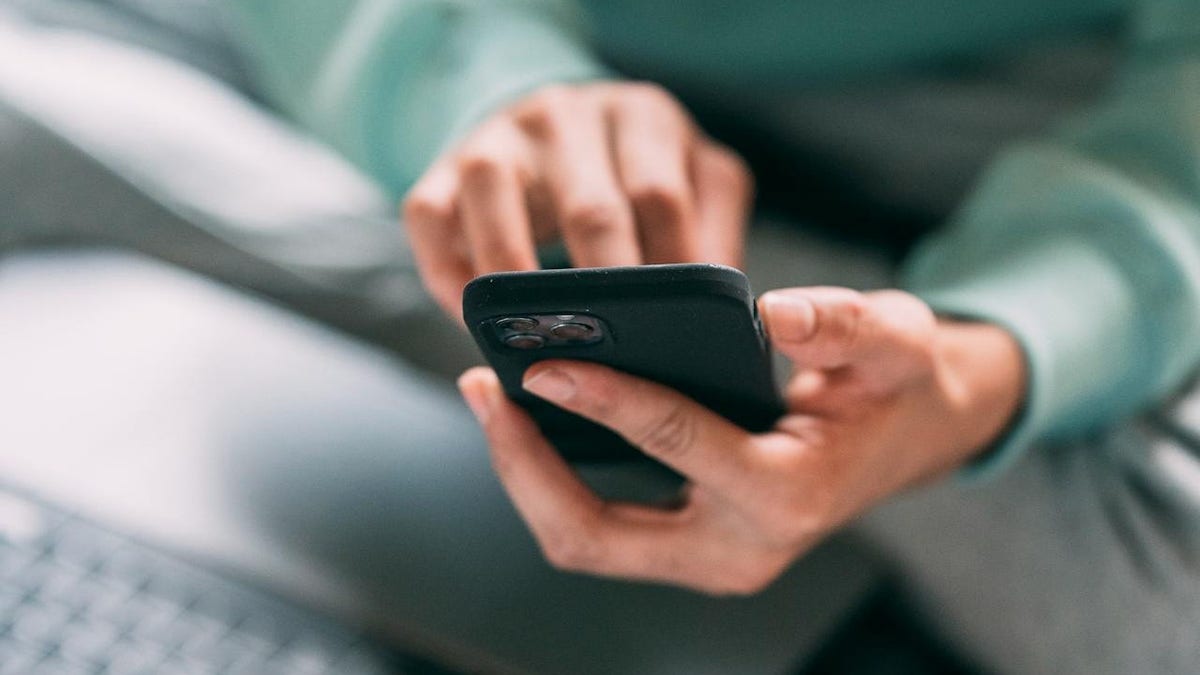 A person holds a phone.