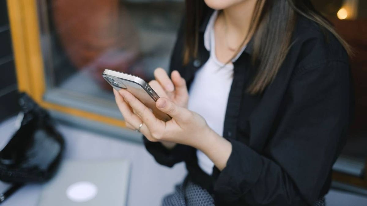 Woman using her smartphone.