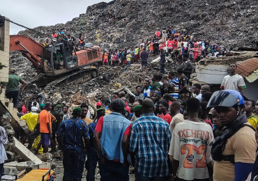 Massive garbage heap collapses onto homes, killing at least 30 as rescuers search for survivors