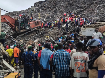 Massive garbage heap collapses onto homes, killing at least 30 as rescuers search for survivors