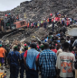 Massive garbage heap collapses onto homes, killing at least 30 as rescuers search for survivors
