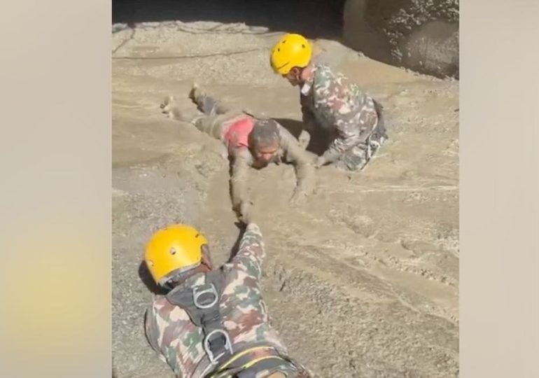 Trapped Nepali workers pulled from hydropower tunnel after catastrophic flooding
