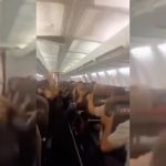 Plane passengers scream in harrowing mid-flight video as violent shaking sends cabin ceiling panels flying