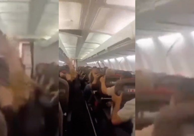 Plane passengers scream in harrowing mid-flight video as violent shaking sends cabin ceiling panels flying