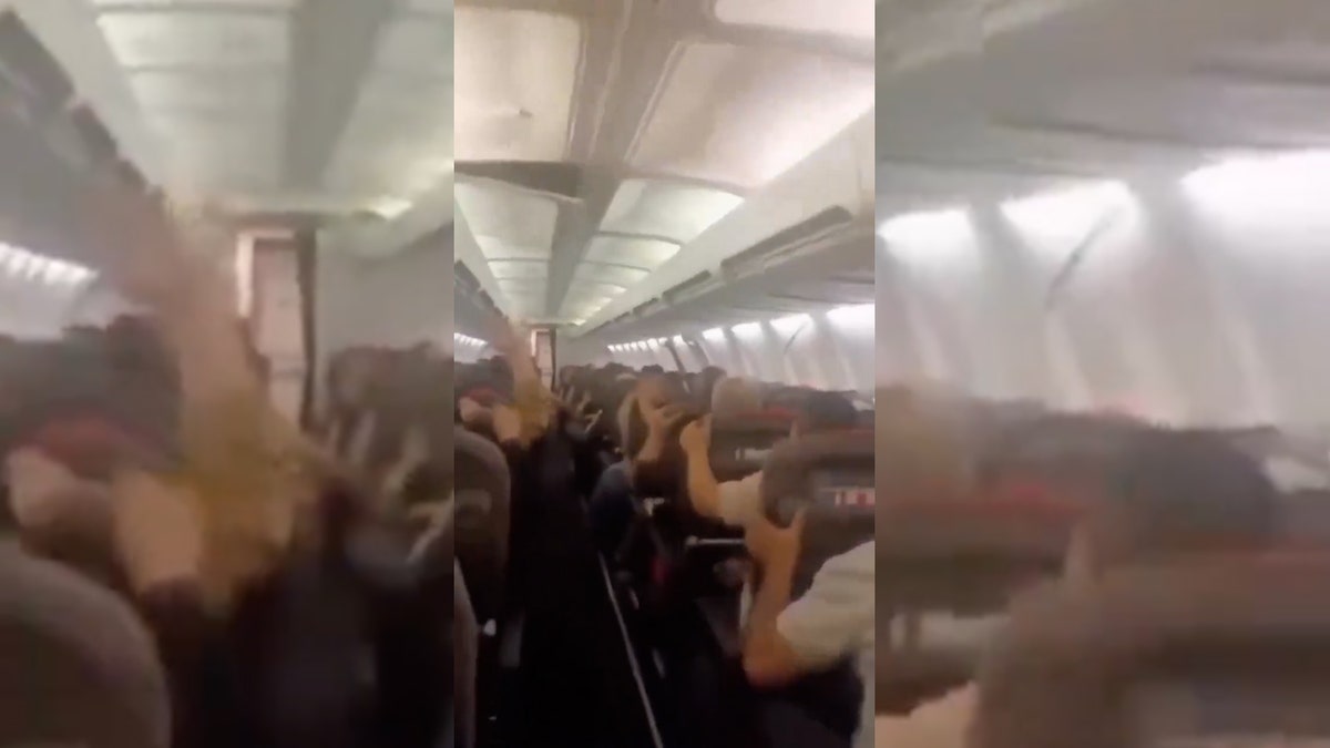 Plane passengers scream in harrowing mid-flight video as violent shaking sends cabin ceiling panels flying