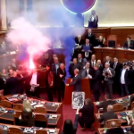 Albanian opposition lawmakers disrupt parliament with smoke flares and furious attacks on socialist PM