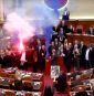 Albanian opposition lawmakers disrupt parliament with smoke flares and furious attacks on socialist PM