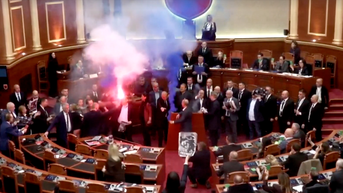 Albanian opposition lawmakers disrupt parliament with smoke flares and furious attacks on socialist PM