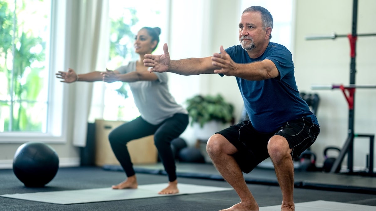 Adults squatting